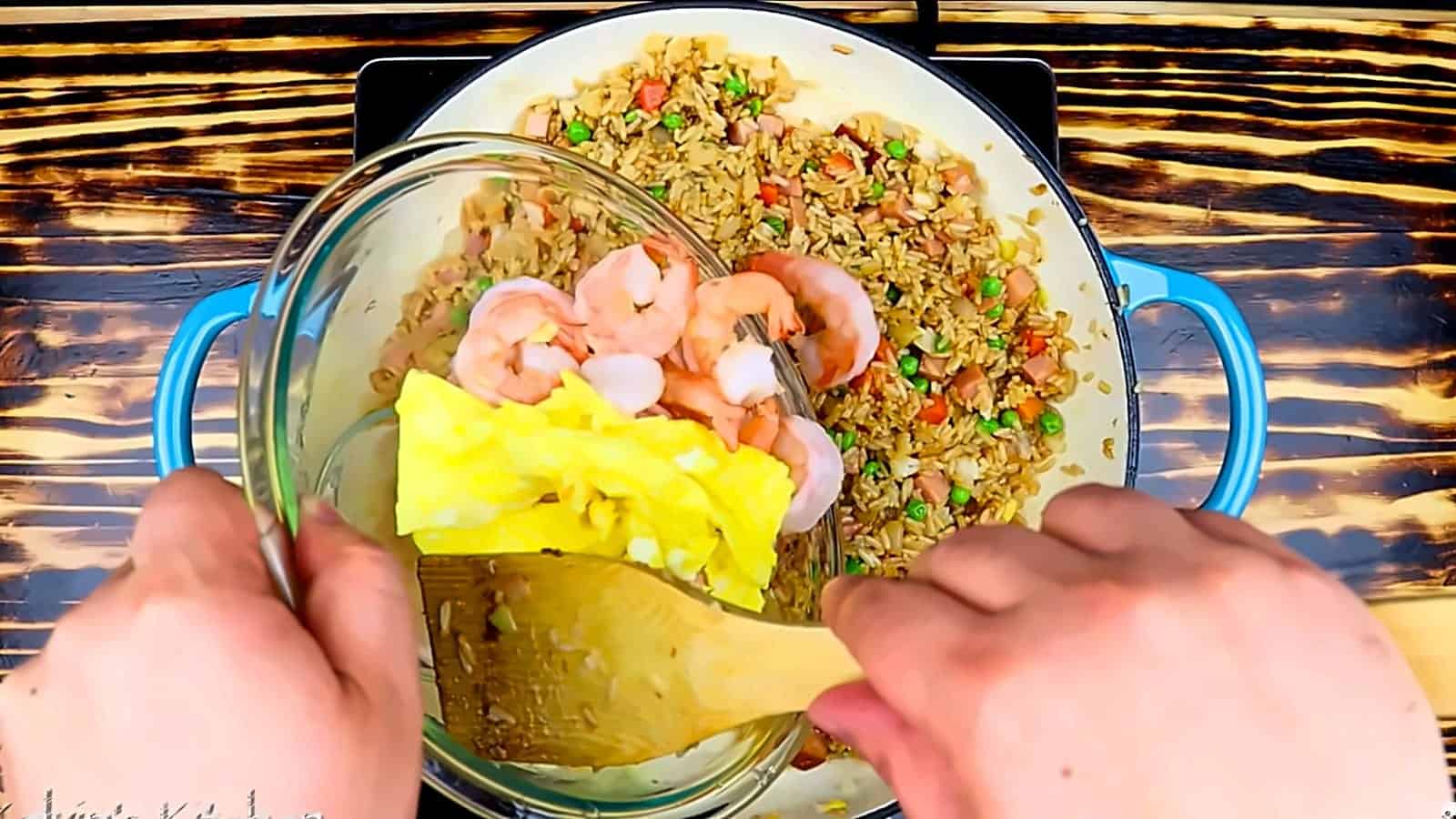 Adding shrimp and egg to the fried rice