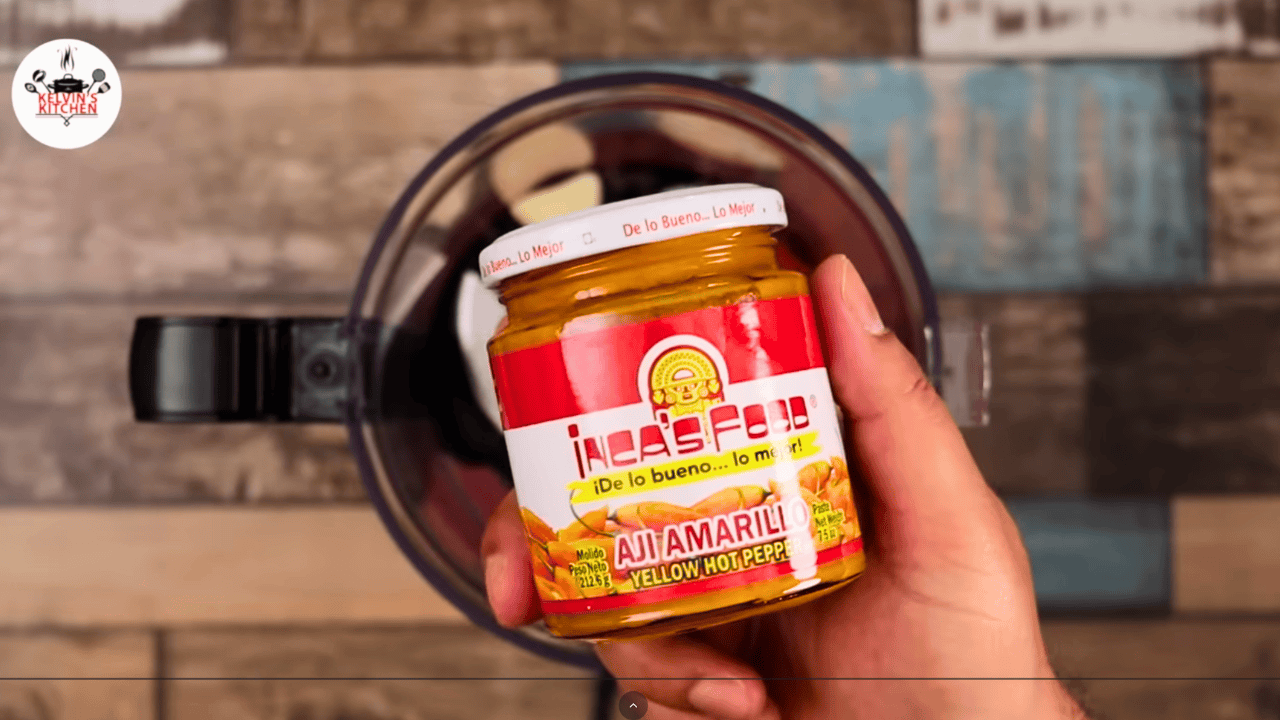Inca's Food aji amarillo yellow hot pepper paste held over a blender