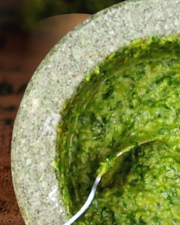 Pesto sauce in mortar and pestle