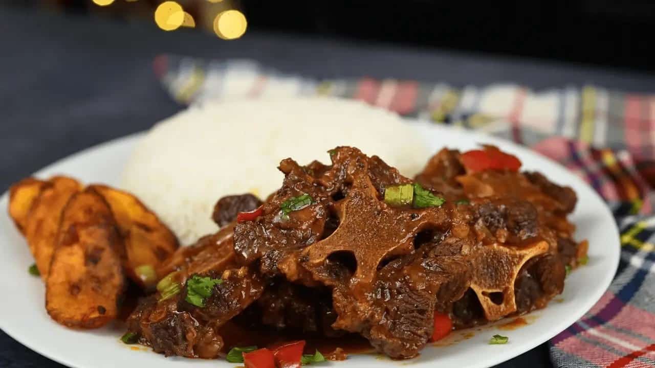 Caribbean Oxtail Stew with white rice and fried plantains