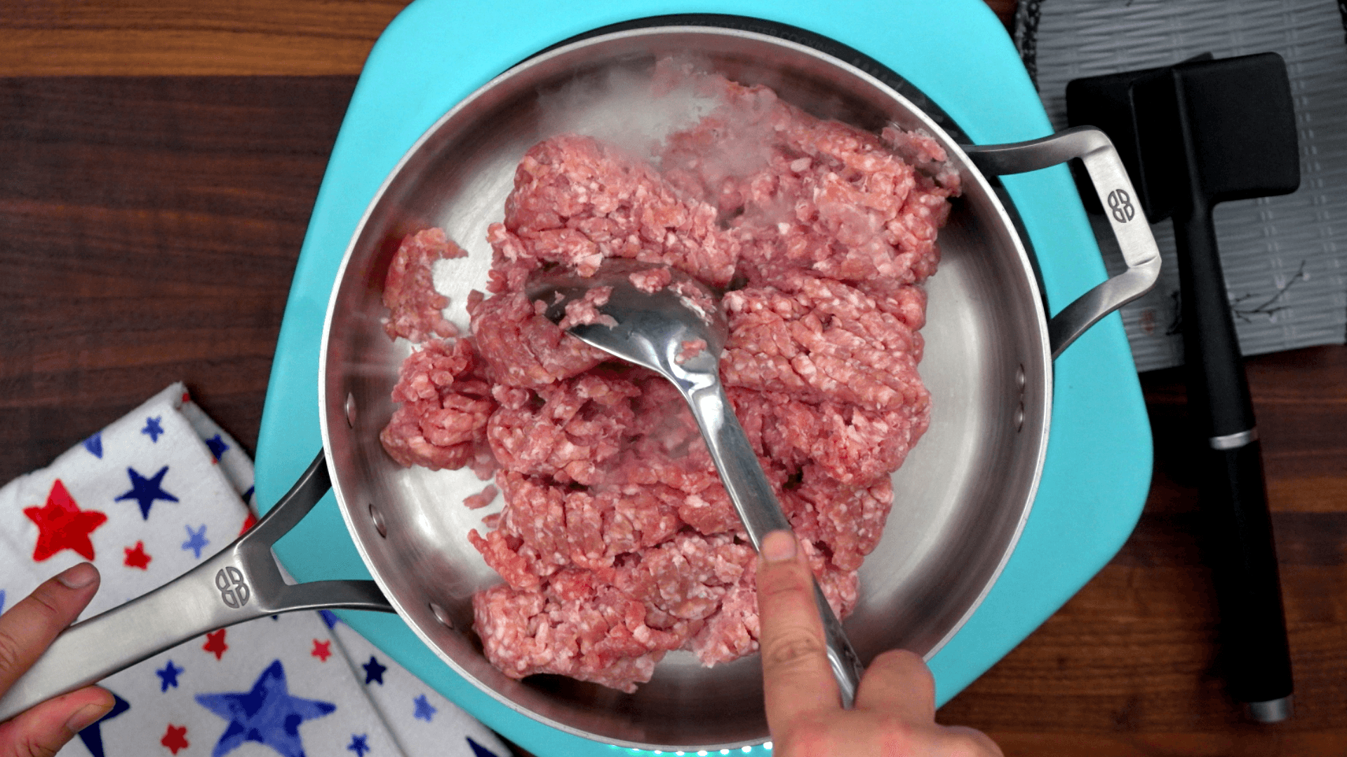 Browning ground pork over high heat in a stainless steel pan for Korean gochujang pork bowls