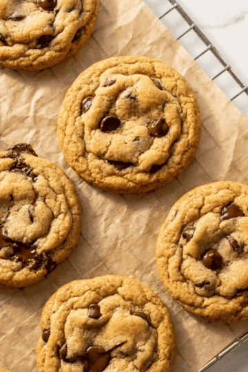 Golden chocolate chip cookies from the air fryer on a cooling rack